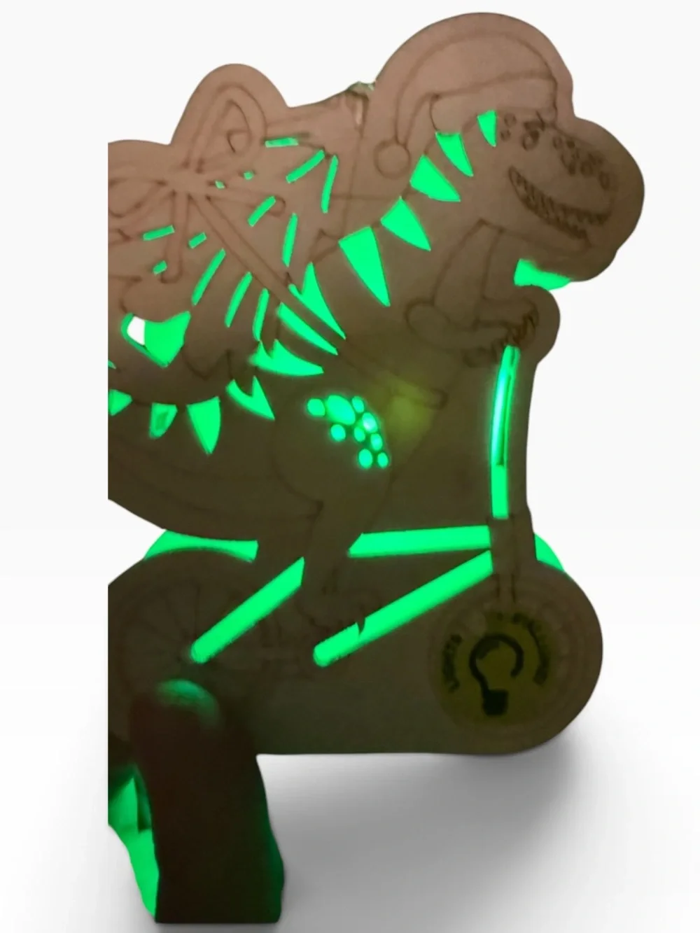 Cut out wood Dino on bike carrying a Christmas tree,